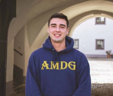 student in AMDG sweater
