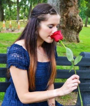 pastoral counseling student smelling Rose
