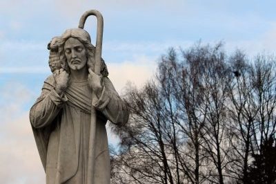 Shepherd holding the lamb statue