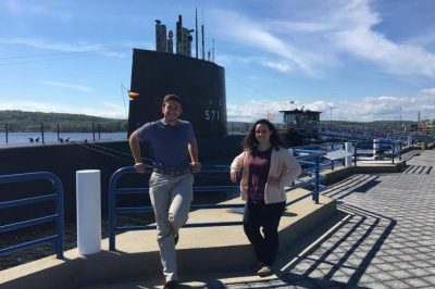 2 Students in front of a submarine