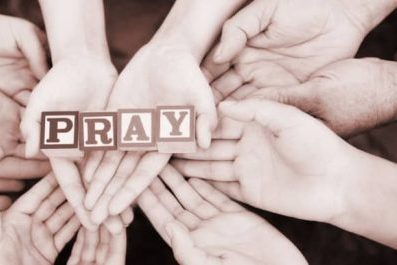 admin-ajax – 2019-05-17T115859.455 hands holding blocks that say pray