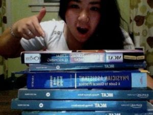 Student pointing at textbooks